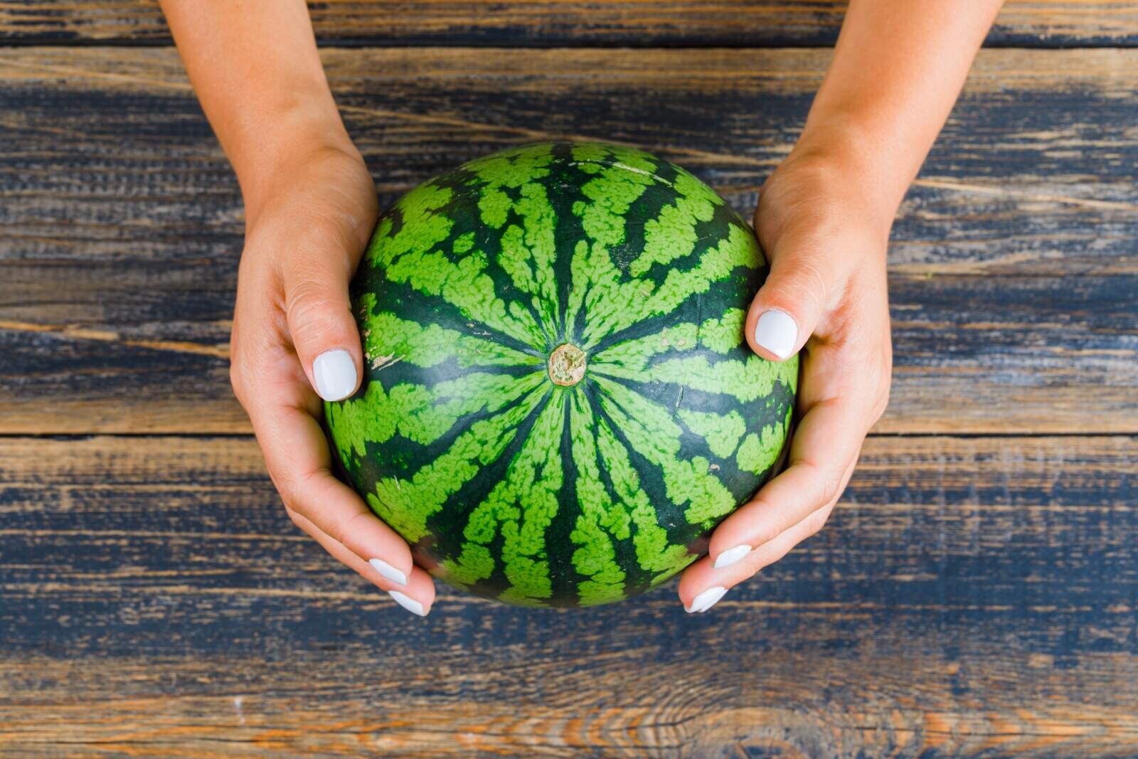 Whole watermelon on table - hero image - Feast on Fruits