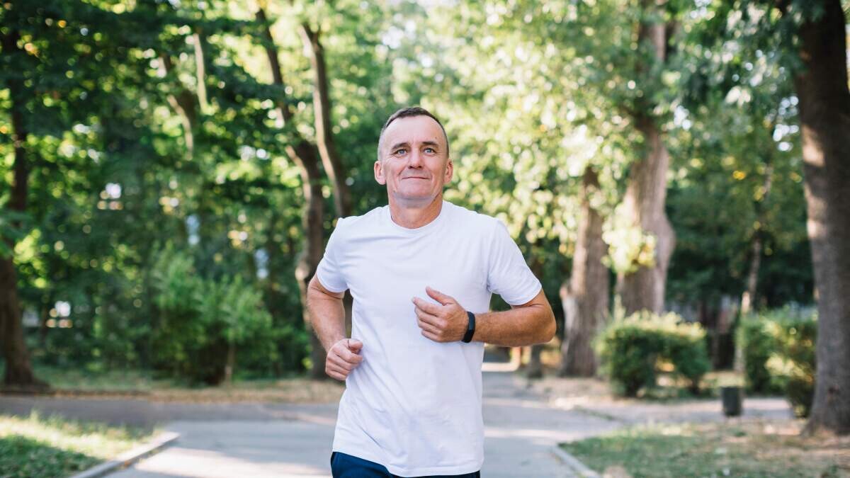 Woman smiling while running outside - Posture Exercises Method